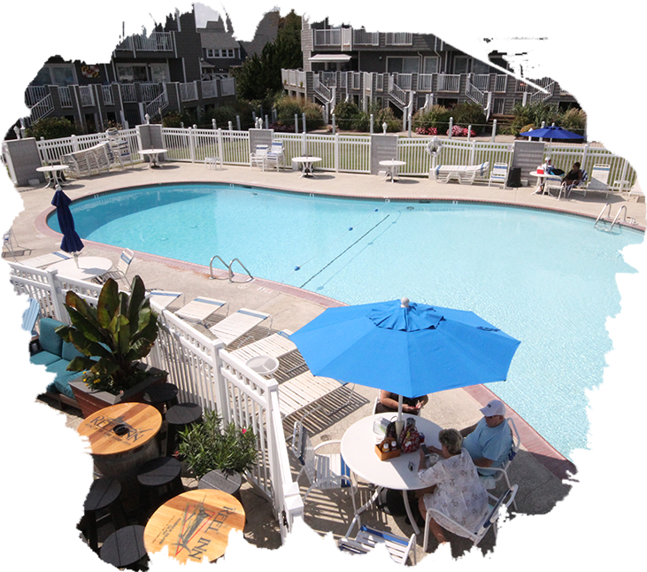 Large chlorine pool with tables and chairs for water front dining at the Reel Inn Restaurant in Ocean City, Maryland